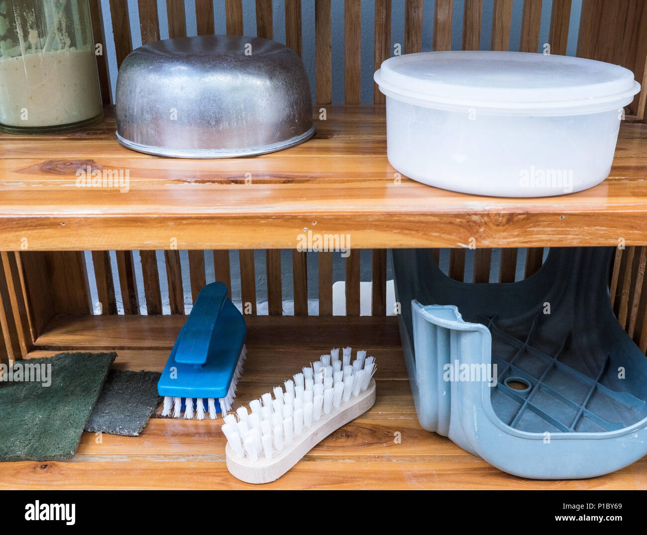 https://c8.alamy.com/comp/P1BY69/group-of-the-washing-brush-and-housework-tool-which-collected-in-the-wooden-shelves-near-the-house-wall-P1BY69.jpg