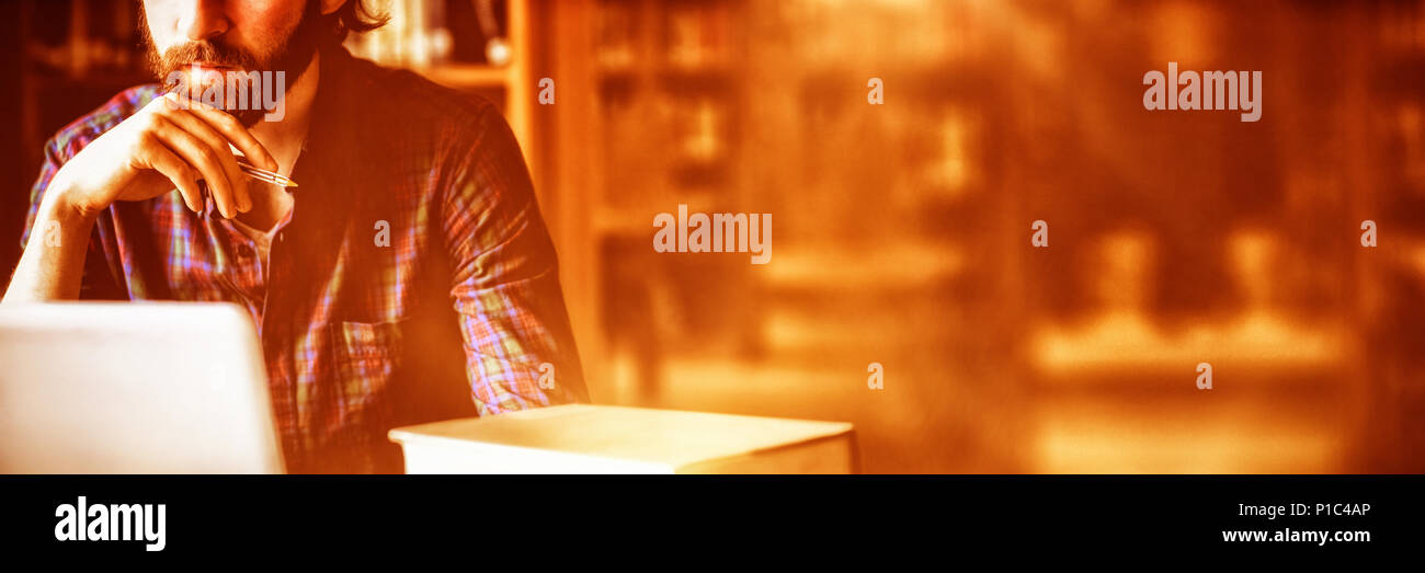 Student studying in library at university Stock Photo
