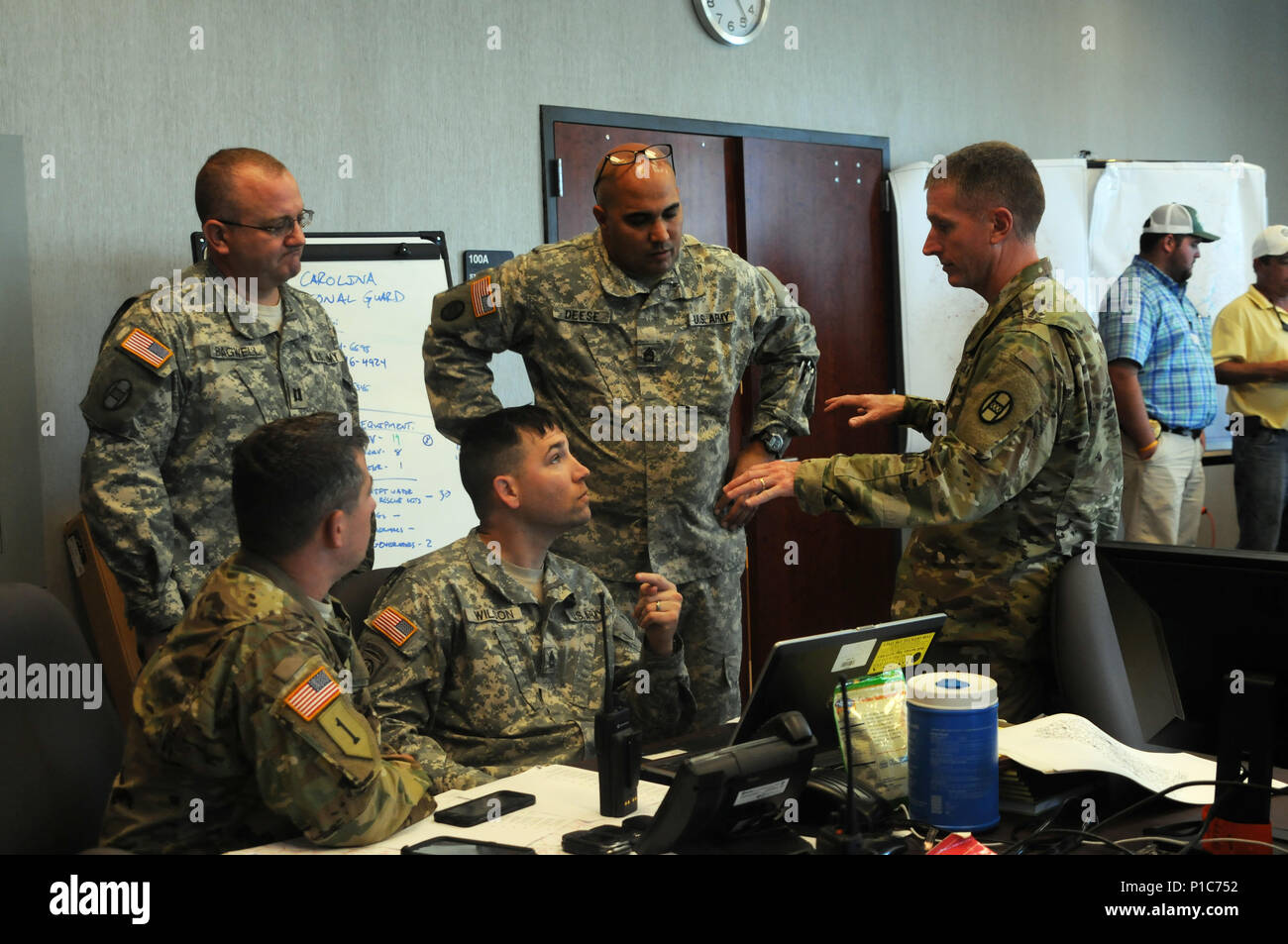 North Carolina National Guard Soldiers work with local first responders and  numerous members of the community to distribute over 1700 cots, over 20  pallets of water and meals-ready-to-eat to displaced citizens in