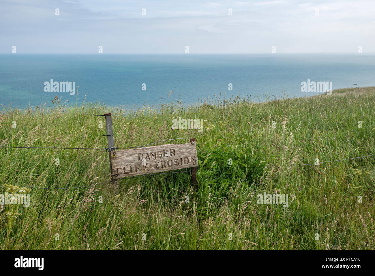 Cliff erosion sign, beach head, Sussex, uk Stock Photo