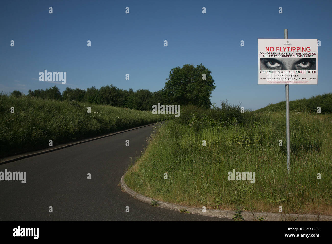 No fly tipping sign seen here near a very active illegal tipping place