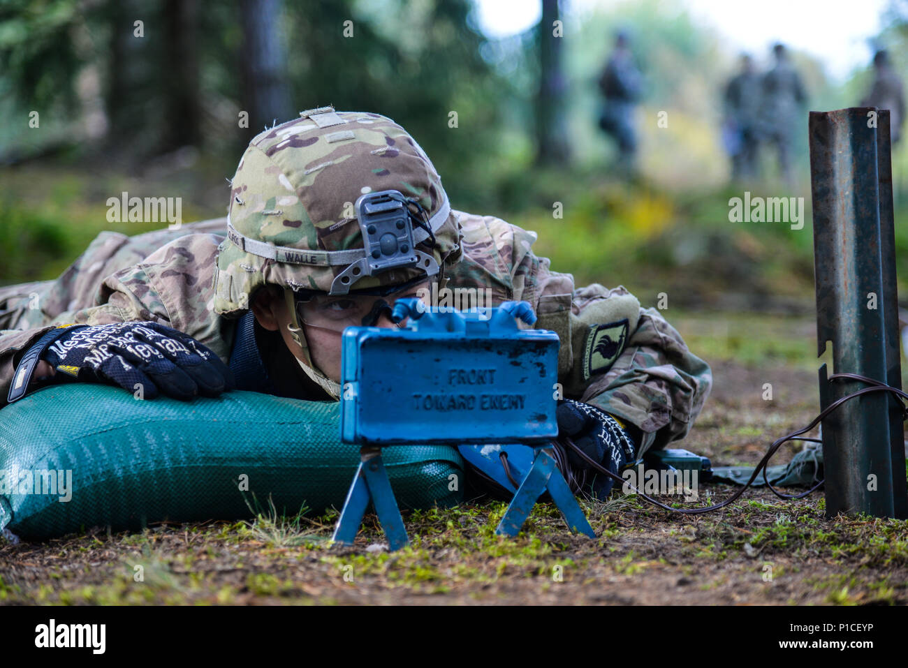 A U.S. Soldier, assigned to the 1st Squadron (Airborne), 91st Cavalry Regiment, 173rd Airborne Brigade trains to employ and recover a M18MA1 Claymore Mine during the Brigade’s Expert Infantryman Badge (EIB) training phase at the 7th Army Training Command’s Grafenwoehr Training Area, Germany, Oct. 17. 2016. The purpose of the EIB is to recognize  Infantryman who have demonstrated a mastery of critical tasks that built the core foundation of individual proficiency that allow them to locate, close with, and destroy the enemy through fire and maneuver and repel an enemy assault through fire and cl Stock Photo