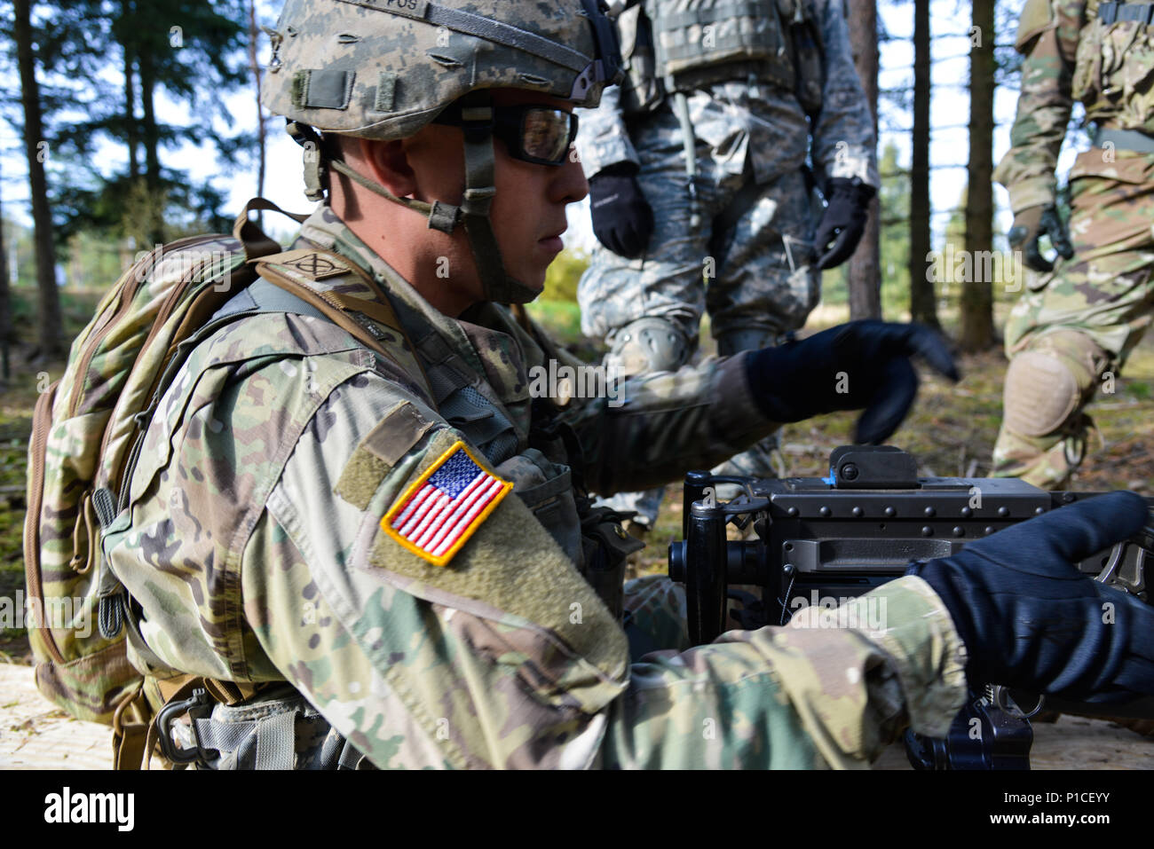 A U.S. Soldier, assigned to the 1st Battalion, 4th Infantry Regiment trains how to clear, load, correct a malfunction, unload and clear a .50 Caliber Machine Gun during the 173rd Airborne Brigade’s Expert Infantryman Badge (EIB) training phase at the 7th Army Training Command’s Grafenwoehr Training Area, Germany, Oct. 17. 2016. The purpose of the EIB is to recognize  Infantryman who have demonstrated a mastery of critical tasks that built the core foundation of individual proficiency that allow them to locate, close with, and destroy the enemy through fire and maneuver and repel an enemy assau Stock Photo