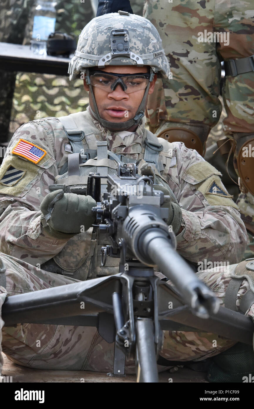 https://c8.alamy.com/comp/P1CF09/us-army-sgt-mark-blackwell-an-infantryman-assigned-to-the-1st-battalion-4th-infantry-regiment-trains-how-to-clear-load-correct-a-malfunction-unload-and-clear-a-caliber-50-machine-gun-oct-17-2016-during-the-173rd-airborne-brigades-expert-infantryman-badge-training-phase-at-the-7th-army-training-commands-grafenwoehr-training-area-in-germany-the-purpose-of-the-expert-infantry-badge-is-to-recognize-infantrymen-who-have-demonstrated-a-mastery-of-critical-tasks-that-build-the-core-foundation-of-individual-proficiency-that-allow-them-to-locate-close-with-and-destroy-the-enemy-throug-P1CF09.jpg