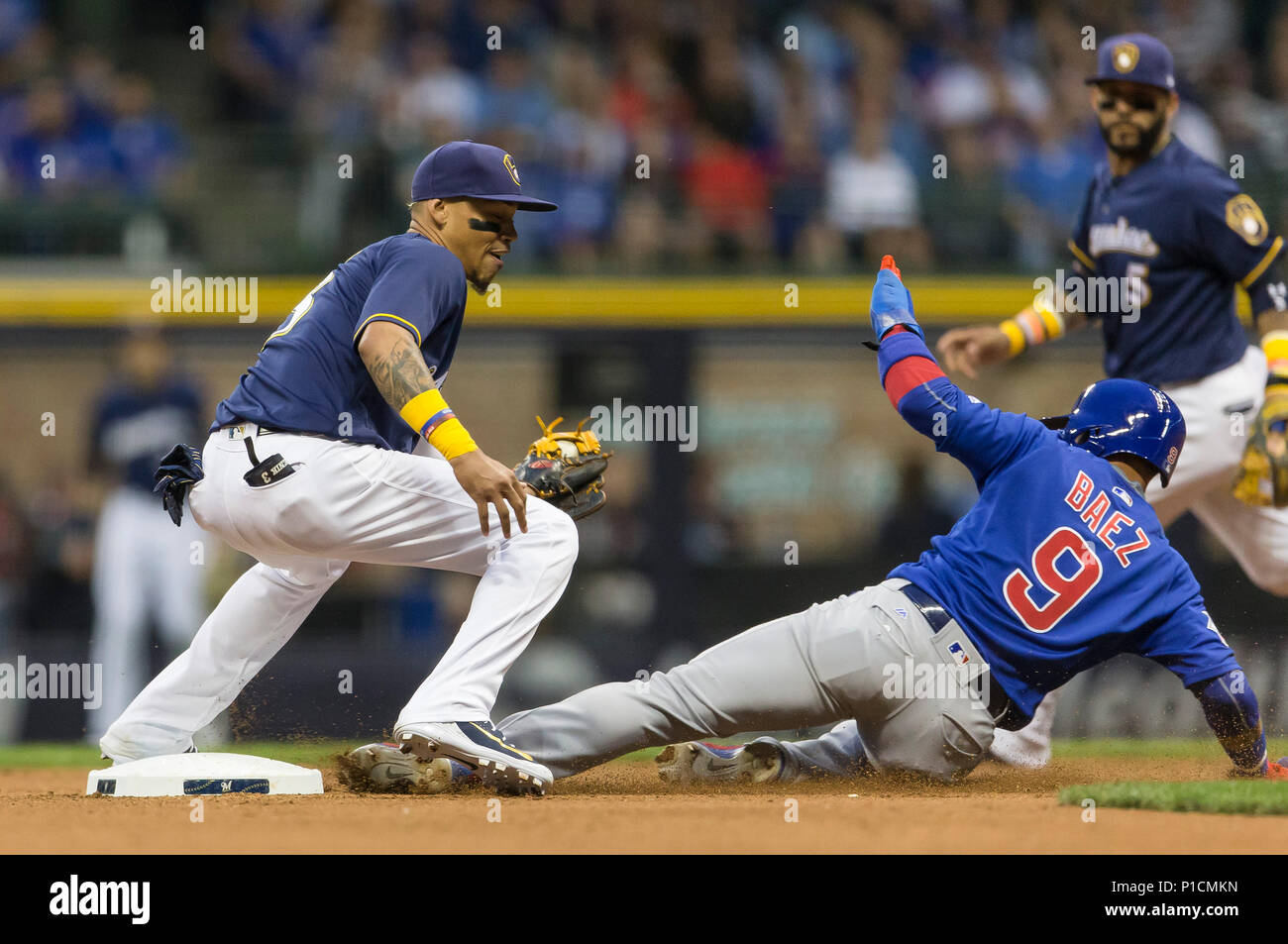 Milwaukee, WI, USA. 11th June, 2018. Chicago Cubs second baseman Javier Baez  #9 steals second base and slides under the tag of .Milwaukee Brewers  shortstop Orlando Arcia #3 during the Major League