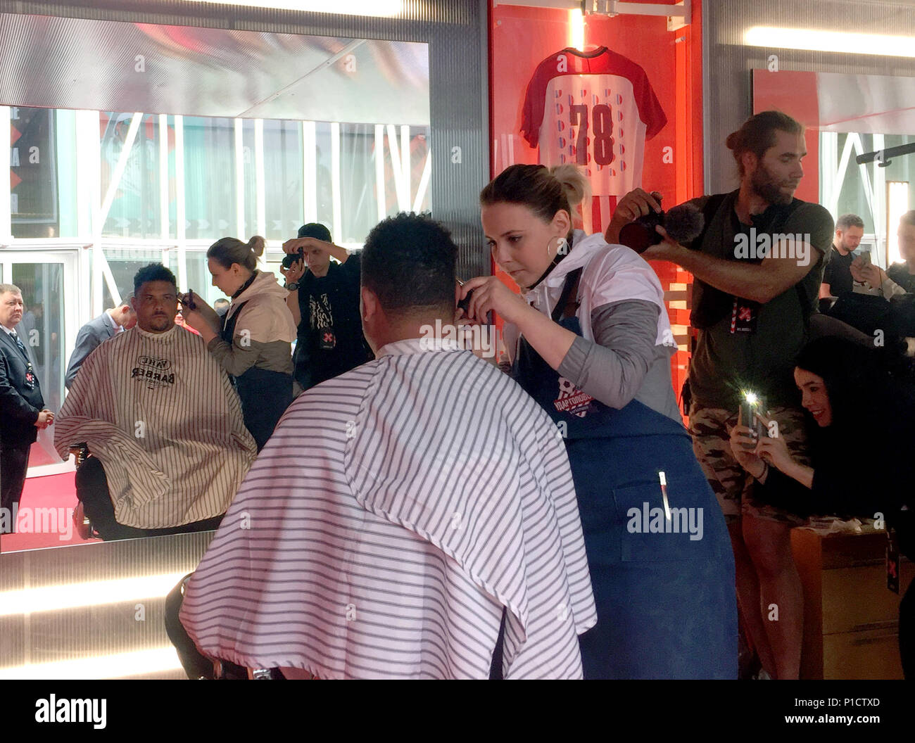 12 June 2018, Russia, Moscow: The former soccer player Ronaldo from Brazil is being styled. The 15-times World Cup goal scorer cleverly got rid of the flock of international journalists after a television interview: Ronaldo went to a hairdresser a couple of metres further away. Photo: Patrick Reichardt/dpa Stock Photo