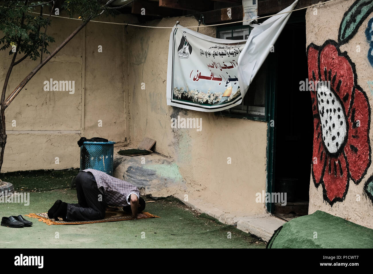 West Bank Israel 12th June 18 A Muslim Man Kneels In Prayer Facing A Banner Depicting Haram Al Sharif In Khan Al Ahmar Abu Al Helu The Israeli High Court Ruled May West Bank Israel 12th June 18 A Muslim Man Kneels In Prayer Facing A Banner Depicting Haram Al Sharif In Khan Al Ahmar Abu Al Helu The Israeli High Court Ruled May