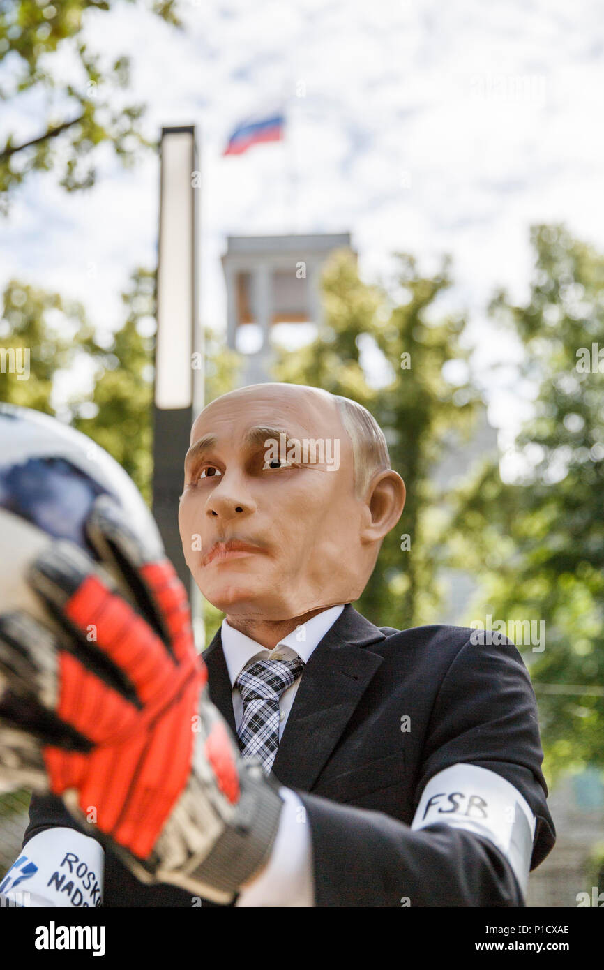 Germany Berlin An Activist Wearing A Mask With The Face Of The President Of Russia Putin Plays With A Soccer Ball During A Protest Campaign Germany Berlin An Activist Wearing A Mask With The Face Of The President Of Russia Putin Plays With A Soccer Ball During A Protest Campaign