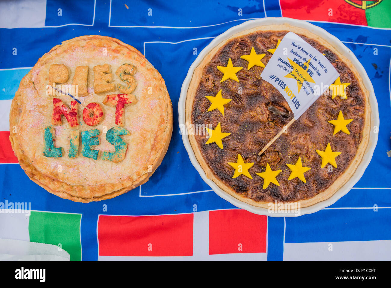 London, UK. 12th june 2018. Pies not Lies on a flag with all teh EU member flags on it- As the commons debate on the Brexit deal approaches, members of SODEM and other anti-Brexit, pro-EU groups gather outside Parliament for a Pies not Lies protest. Credit: Guy Bell/Alamy Live News Stock Photo