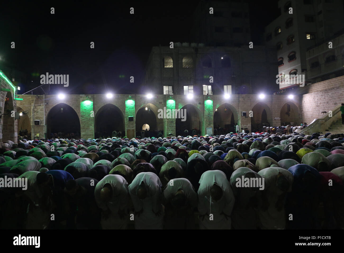 General view from inside the mosque as muslims performs night prayer. Palestinian worshippers attend a night prayer during Laylat Al-Qadr, on the 27th day of the holy fasting month of Ramadan at al-Omari mosque in Gaza City. Laylat Al-Qadr is the holiest night in the Ramadan month which commemorates the revealing of the holy book of Quran to Prophet. Stock Photo