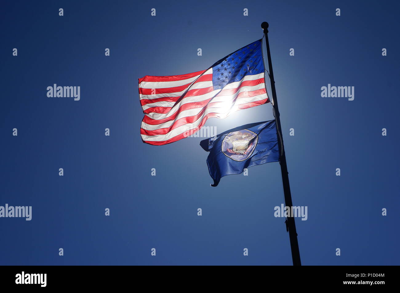 American flag waving in the wind with the sun at it's back. Taken in Salt Lake City, Utah. Stock Photo