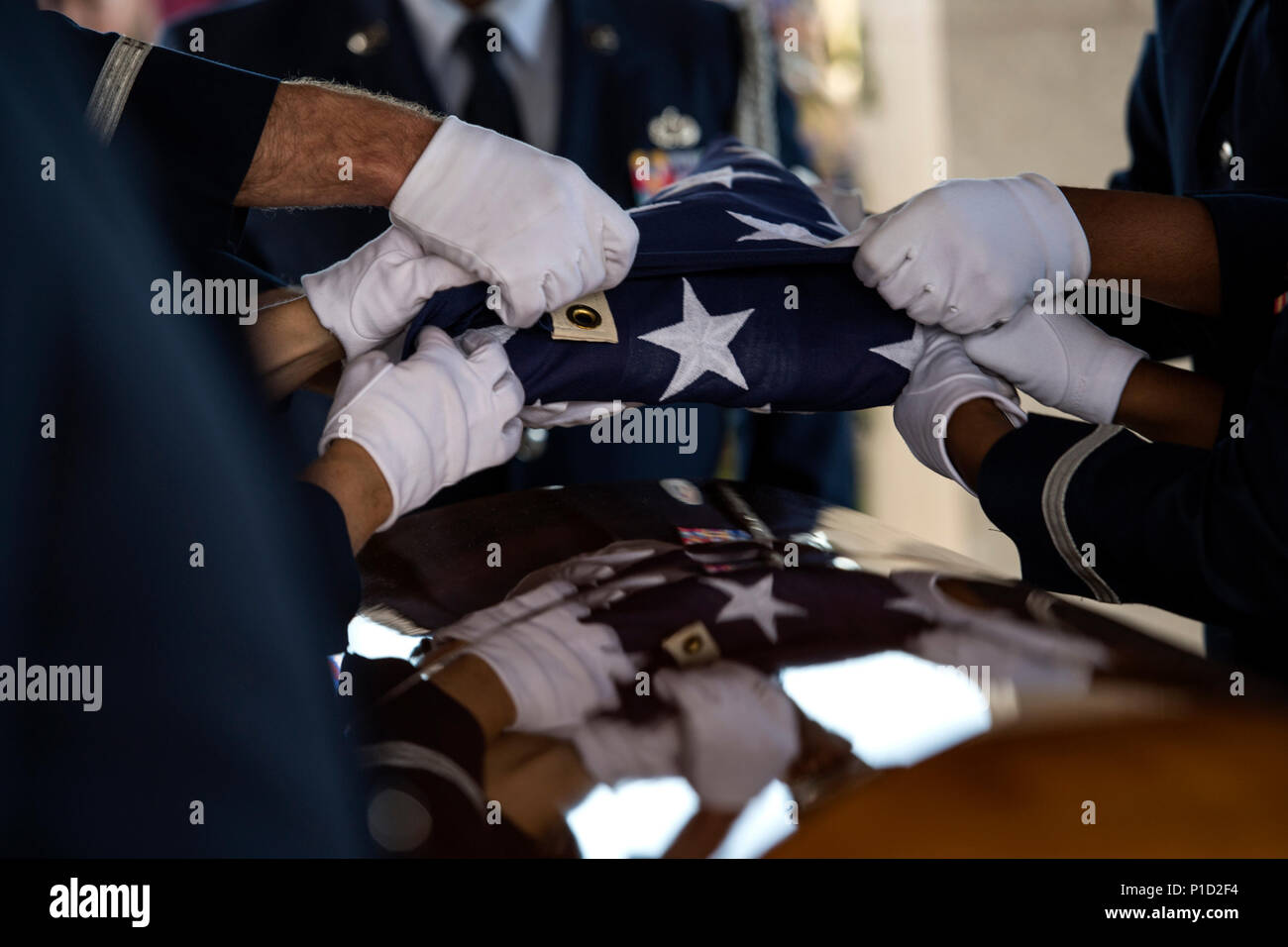 Military Rites Members of the Moody Air Force Base Honor Guard fold the United States ...