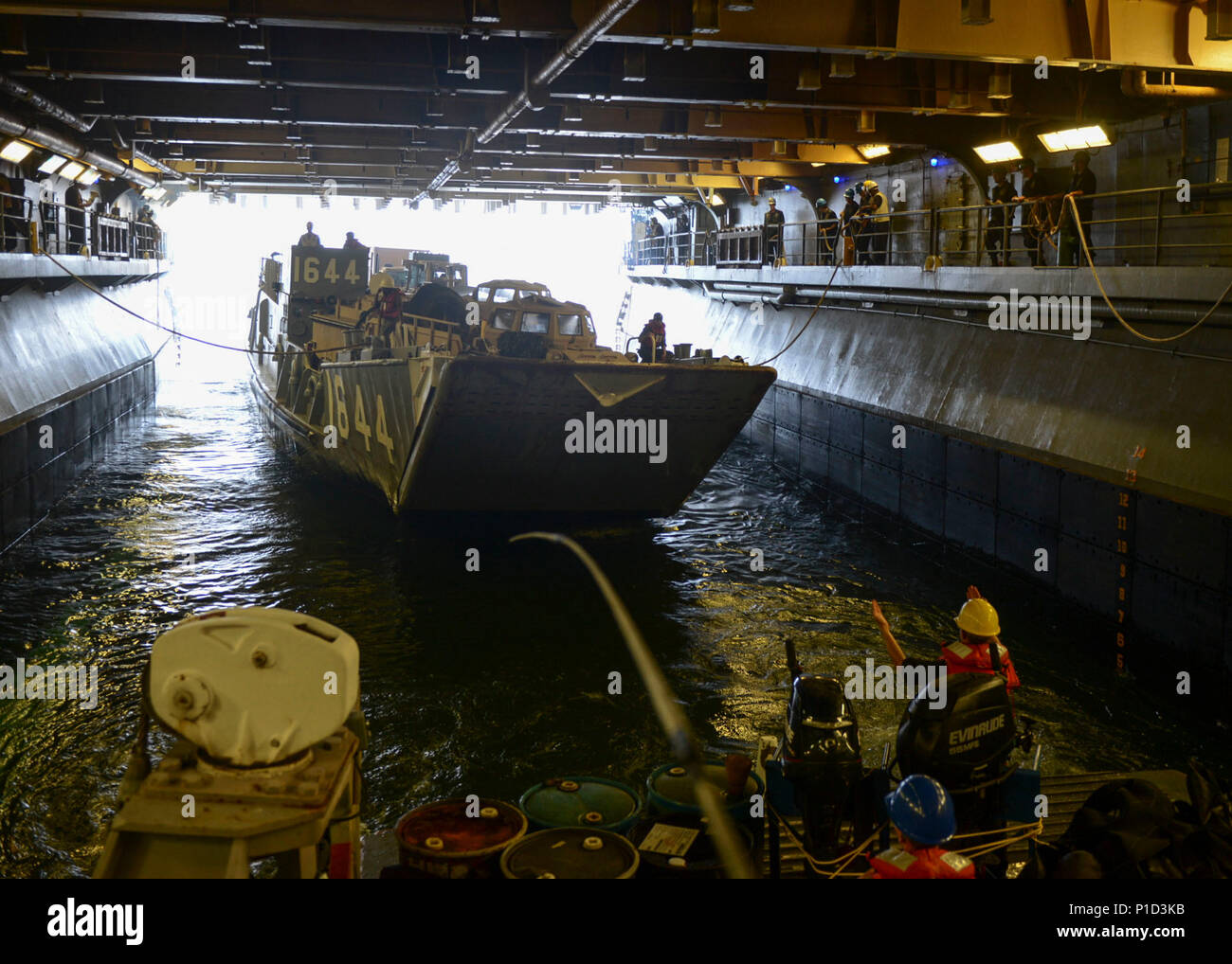161013-N-RL456-1067 CARRIBEAN SEA (Oct. 13, 2016) Landing craft utility 1644, assigned to Assault Craft Unit 2 enters the well deck of the amphibious assault ship USS Iwo Jima (LHD 7) during well deck operations. Iwo Jima and the 24th Marine Expeditionary Unit are underway to provide disaster relief and humanitarian aid to Haiti following Hurricane Matthew. (U.S. Navy photo by Petty Officer 2nd Class Hunter S. Harwell/Released) Stock Photo