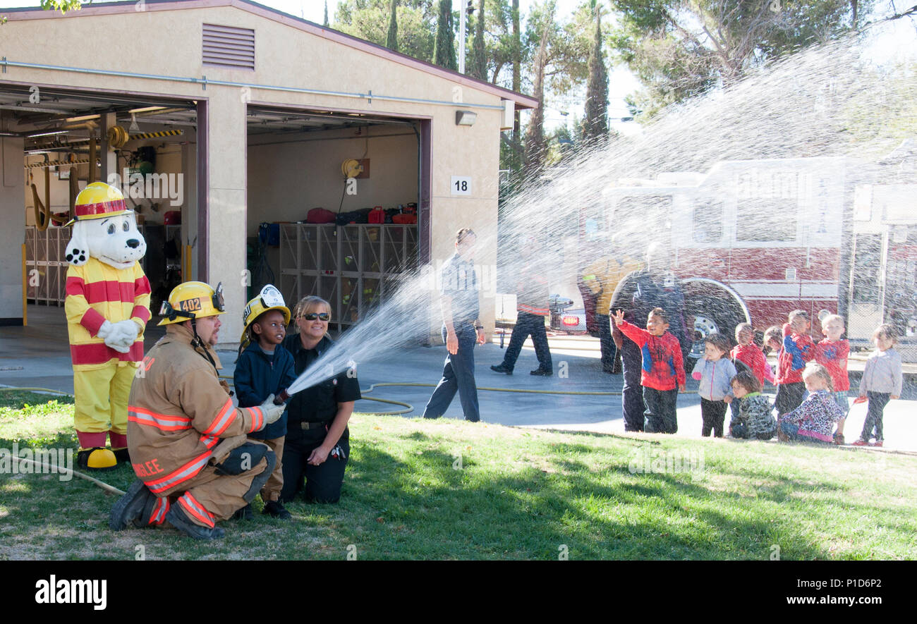 (Left) Sparky the Fire Dog, mascot of the Marine Corps Logistics Base