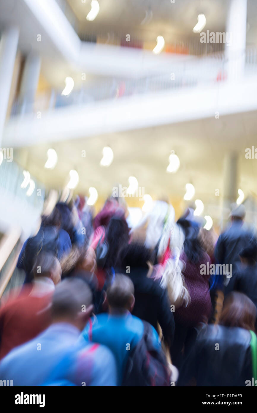 Blurred motion business people ascending stairs Stock Photo