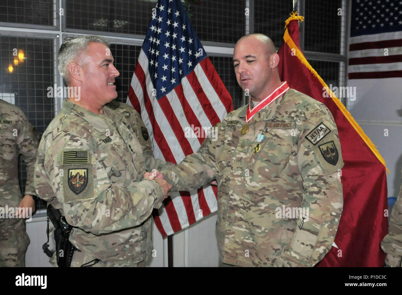 Master Sgt. Michael L. Bowman of Melbourne, Florida is congratulated by Maj. Gen. Richard G. Kaiser for being awarded the Bronze Order of the De Fleury Medal this week for his career achievements in training military engineers and service to Combined Joint Engineering directorate of Combined Security Transition Command - Afghanistan.  Kaiser, who is the Senior Engineer in theater, is also the commanding general of CSTC-A    The De Fleury Medal, an award of the US Army Engineer Association, was named in honor of François-Louis Teissèdre de Fleury, a French Engineer in the Continental Army durin Stock Photo