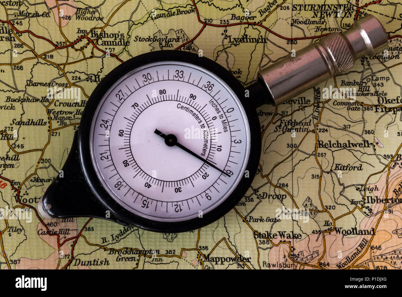 Dorking, England June 11 2018 Old map measuring instrument used