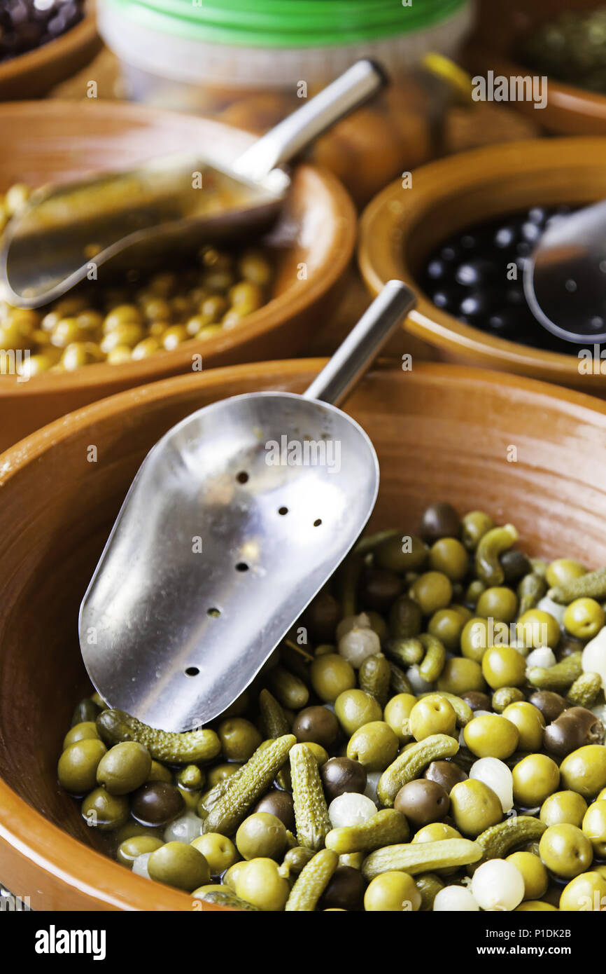 Olives in a traditional market, detail of olives preserved in oil Stock Photo Alamy
