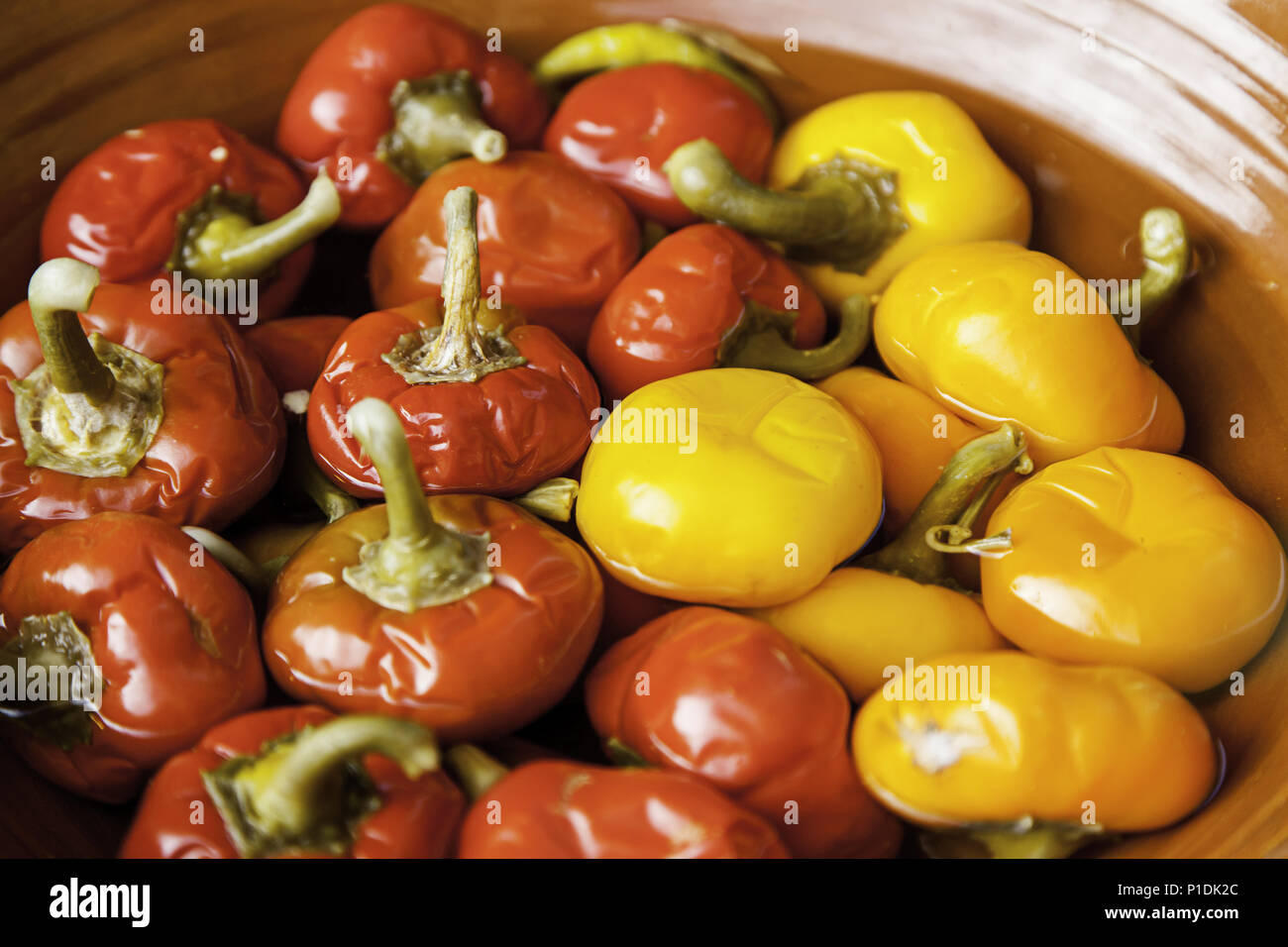 Peppers preserved in oil, detail of raw vegetables, healthy food Stock