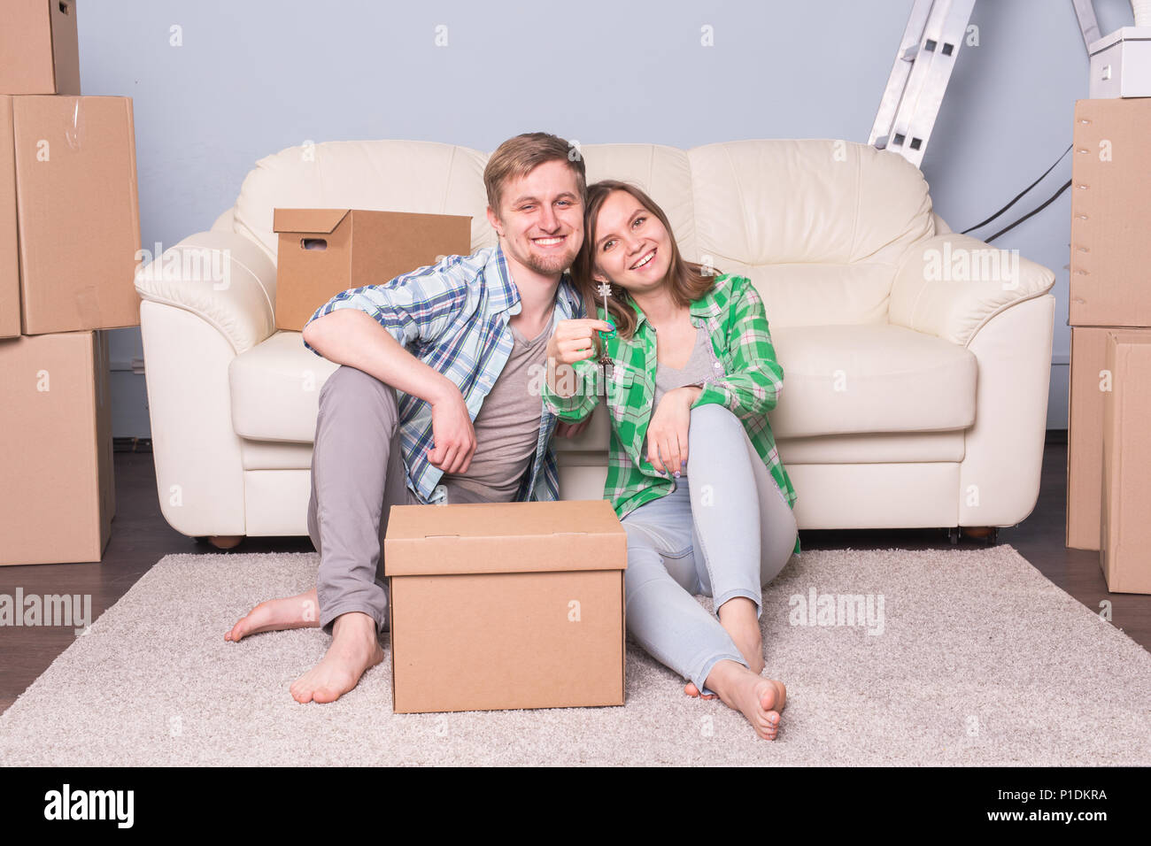 Happy love couple in her new home holding key Stock Photo - Alamy