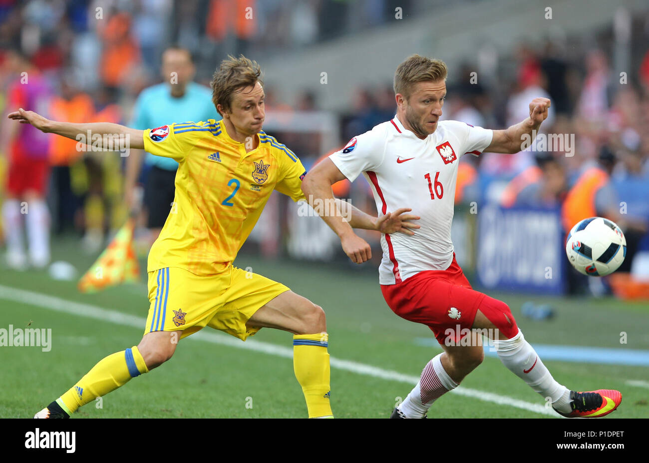 MARSEILLE, FRANCE - JUNE 21, 2016: Bohdan Butko of Ukraine (L) fights for a ball with Jakub Blaszczykowski of Poland during their UEFA EURO 2016 game  Stock Photo