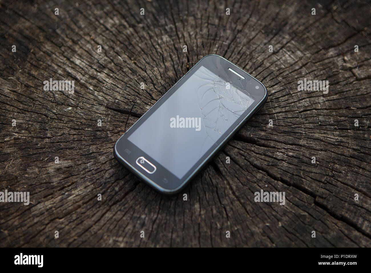 Broken mobile phone. Mobile phone with broken screen. Stock Photo