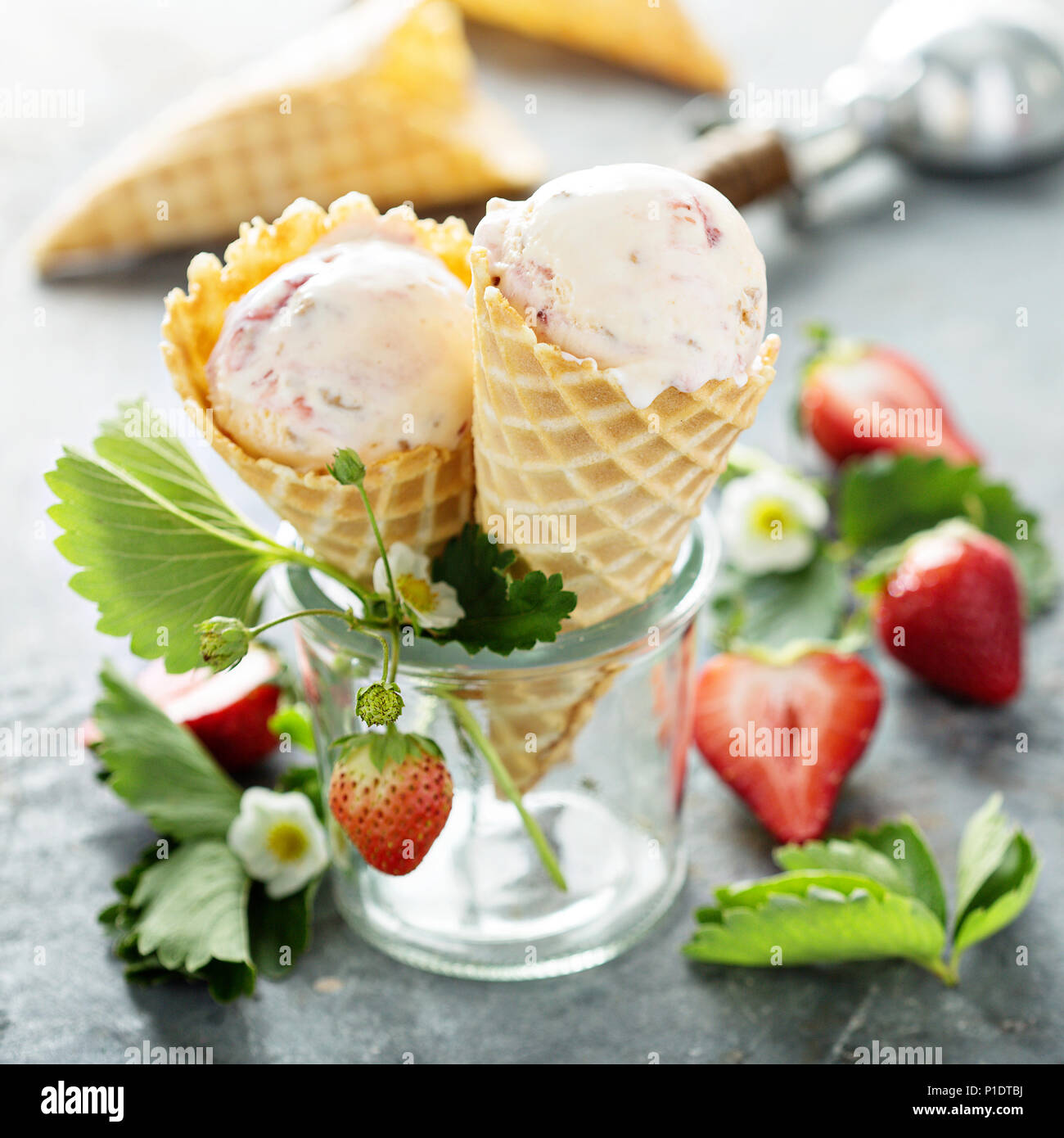 Strawberry ice cream in waffle cones Stock Photo Alamy