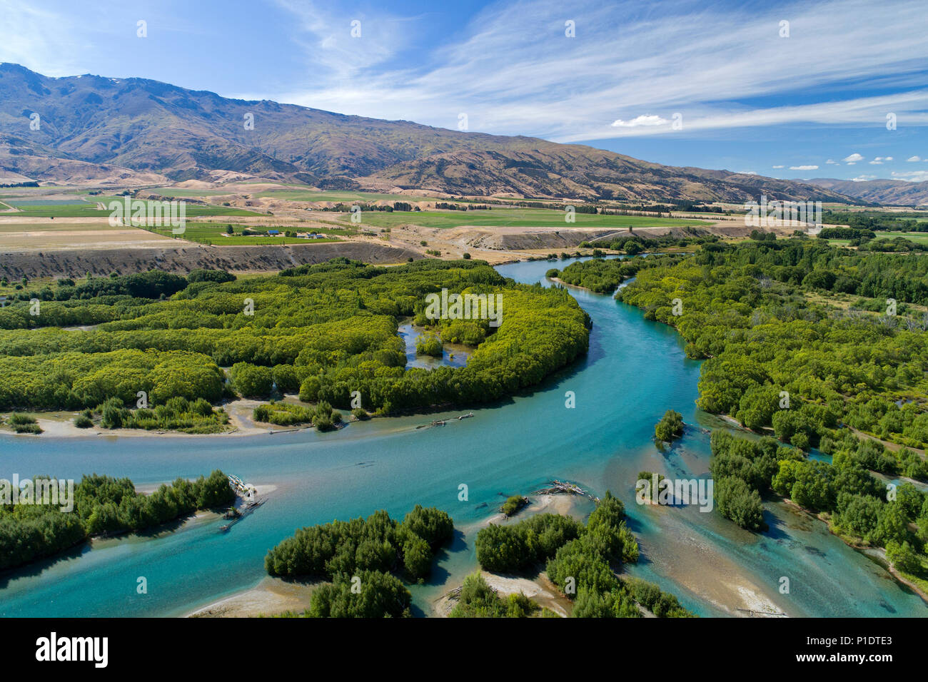Channels of Clutha River entering Lake Dunstan, Central Otago, South Island, New Zealand - drone aerial Stock Photo