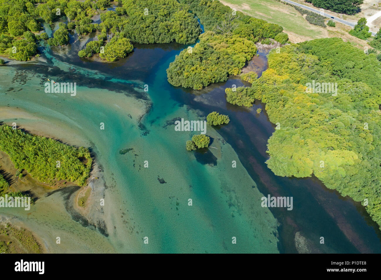 Channels of Clutha River entering Lake Dunstan, Central Otago, South Island, New Zealand - drone aerial Stock Photo