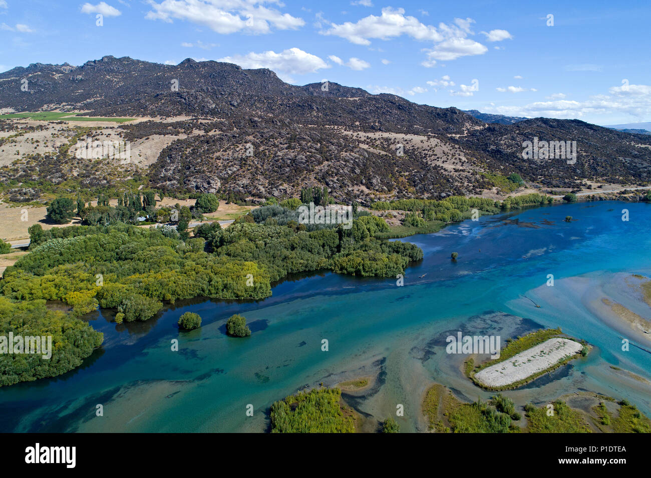 Clutha River entering Lake Dunstan, Central Otago, South Island, New Zealand - drone aerial Stock Photo