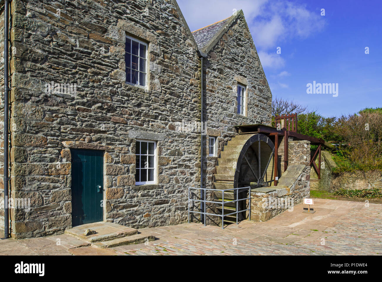 Quendale Mill, restored 19th century overshot watermill / water mill at Dunrossness, Shetland Islands, Scotland, UK Stock Photo