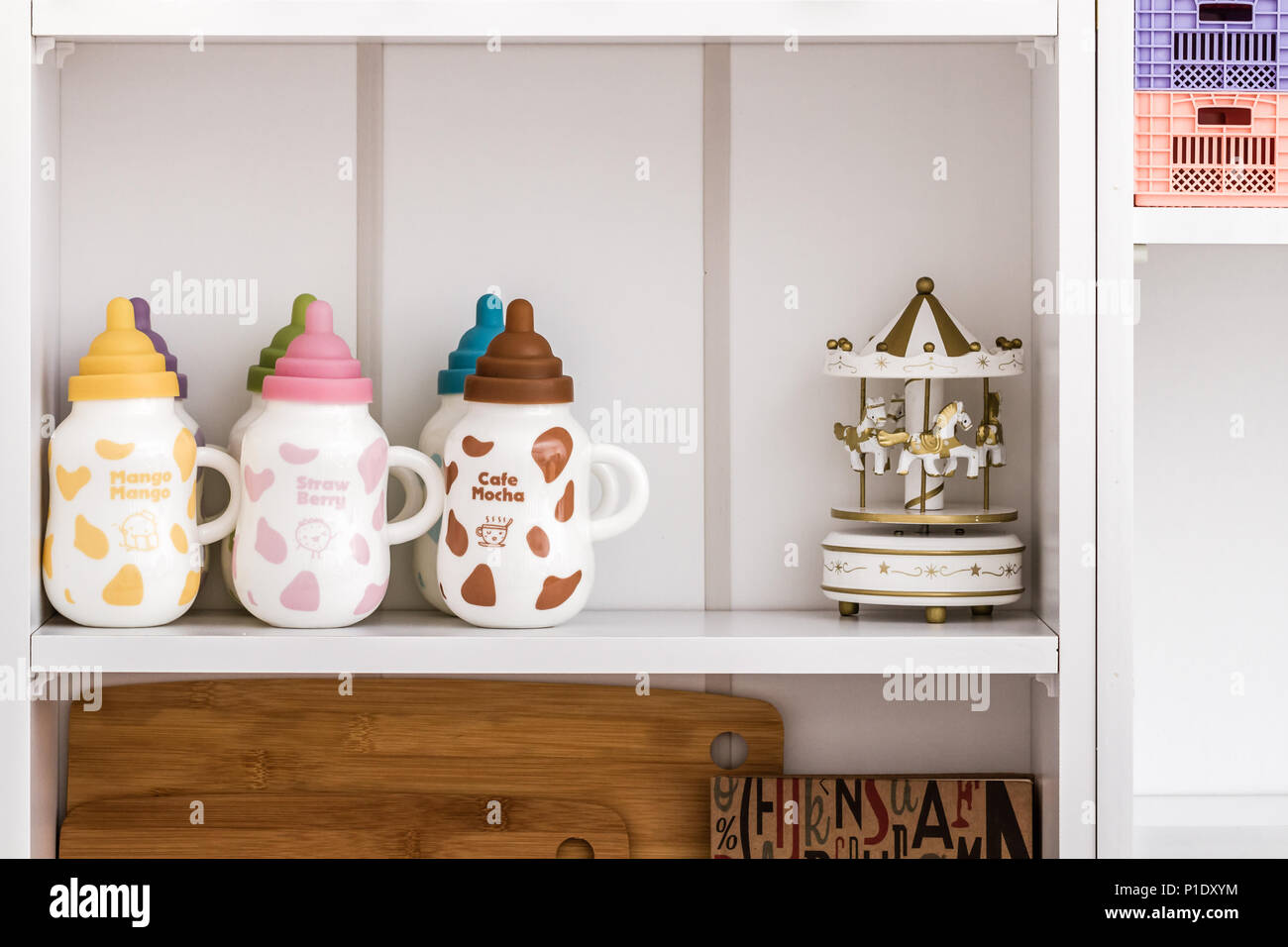 Decorative objects on white shelf Stock Photo Alamy