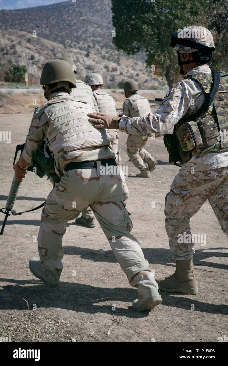 Peshmerga soldiers prepare to assault an objective under the guidance ...