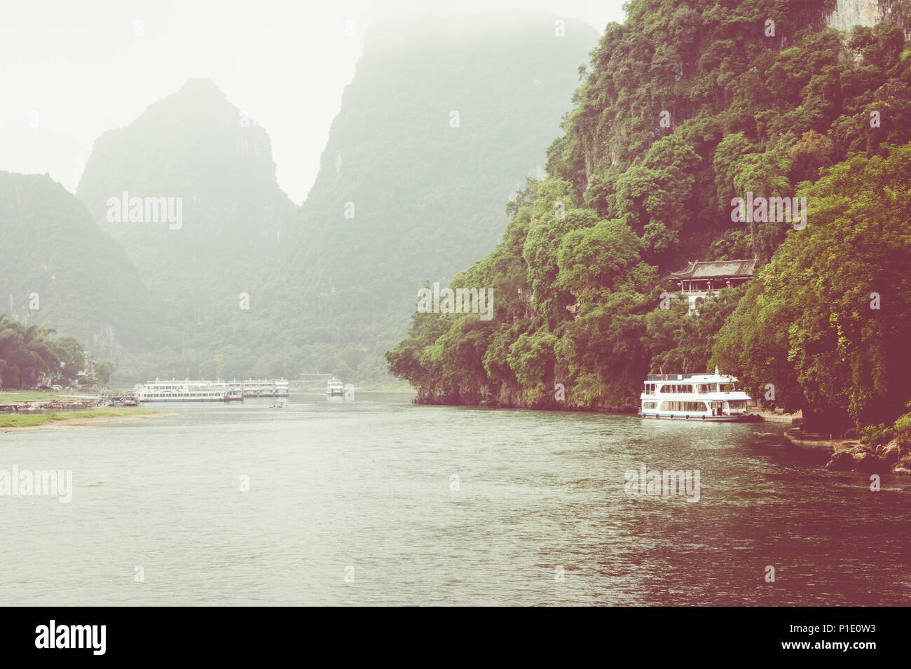 Scenic landscape at Yangshuo County of Guilin, China. View of beautiful karst mountains and the Li River (Lijiang River) with azure water. Amazing gre Stock Photo