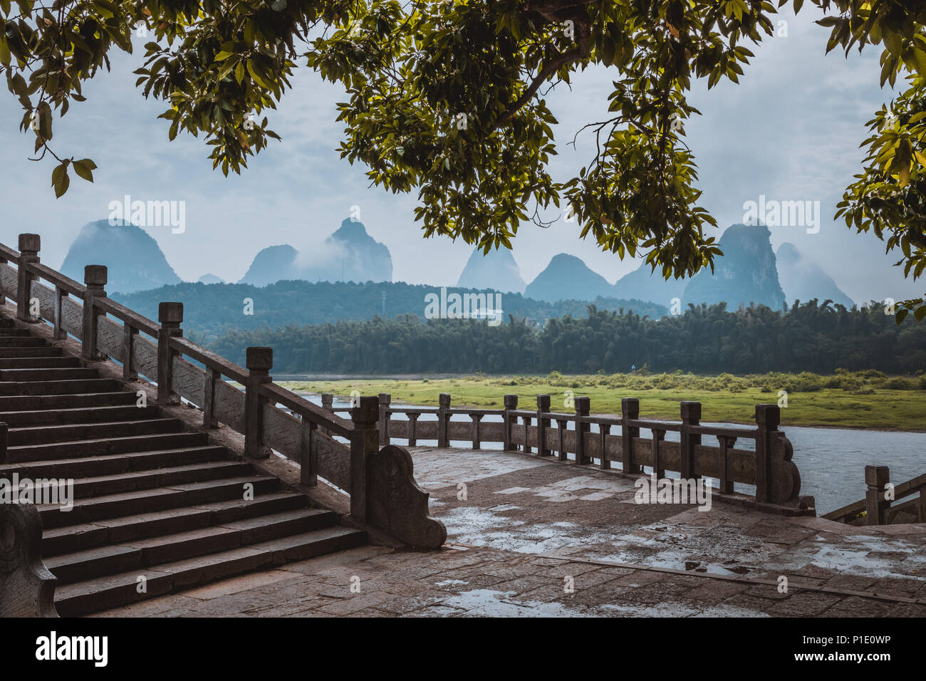 Scenic landscape at Yangshuo County of Guilin, China. View of beautiful karst mountains and the Li River (Lijiang River) with azure water. Amazing gre Stock Photo