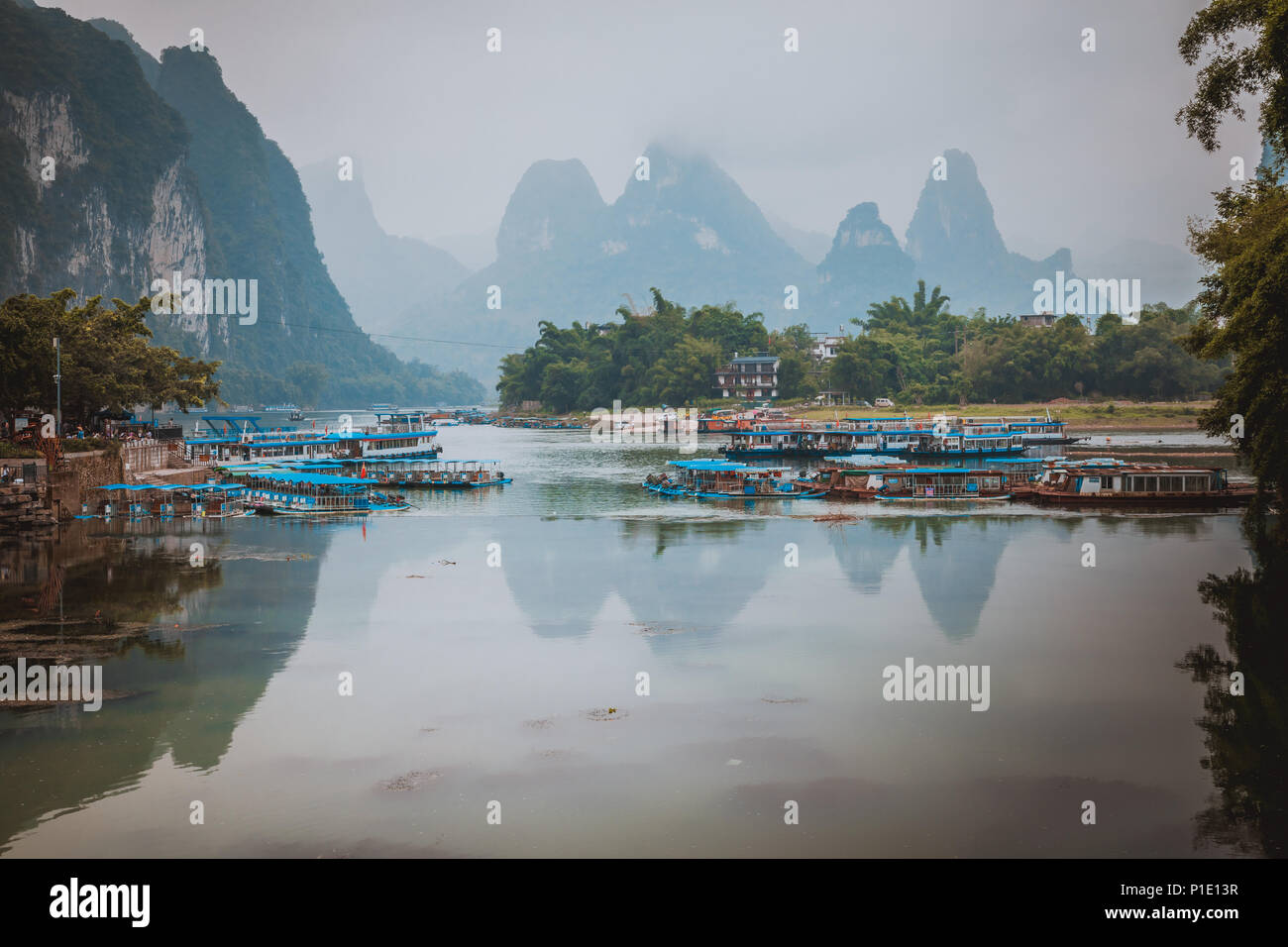 Li River (Lijiang River). Pleasure boats at the pier in Xingping Town Stock Photo