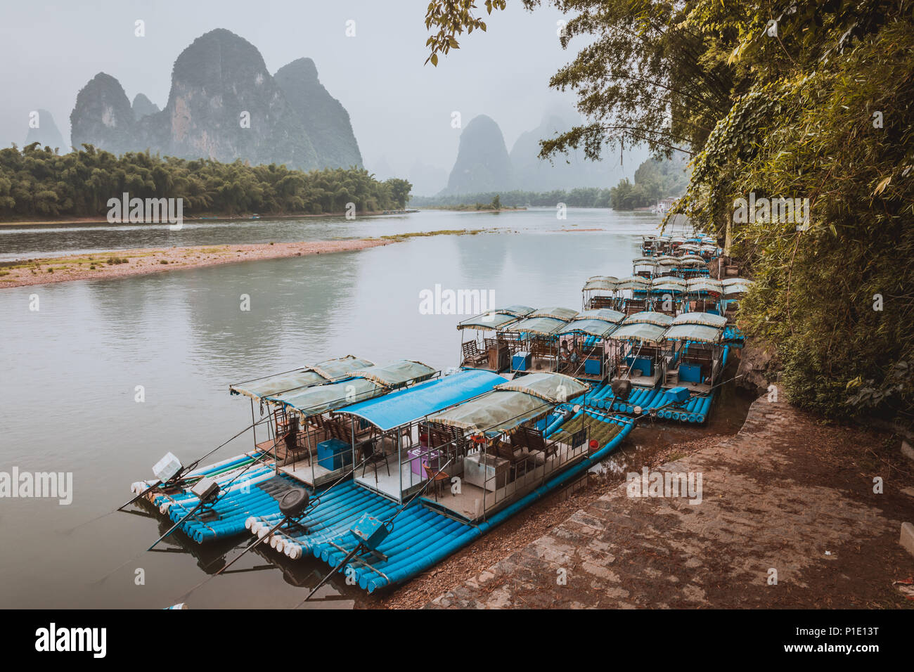 XINGPING, CHINA - MAY 29, 2018: Li River (Lijiang River). Pleasure boats at the pier in Xingping Town Stock Photo