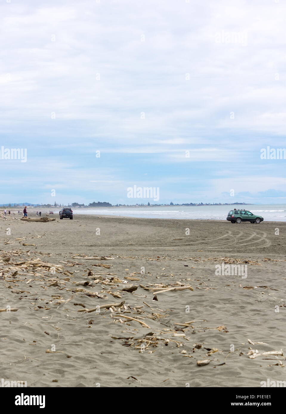 Waikanae, New Zealand - 23 October 2016: People and vehicles on the beach at Waikanae on the Kapiti Coast of New Zealand Stock Photo