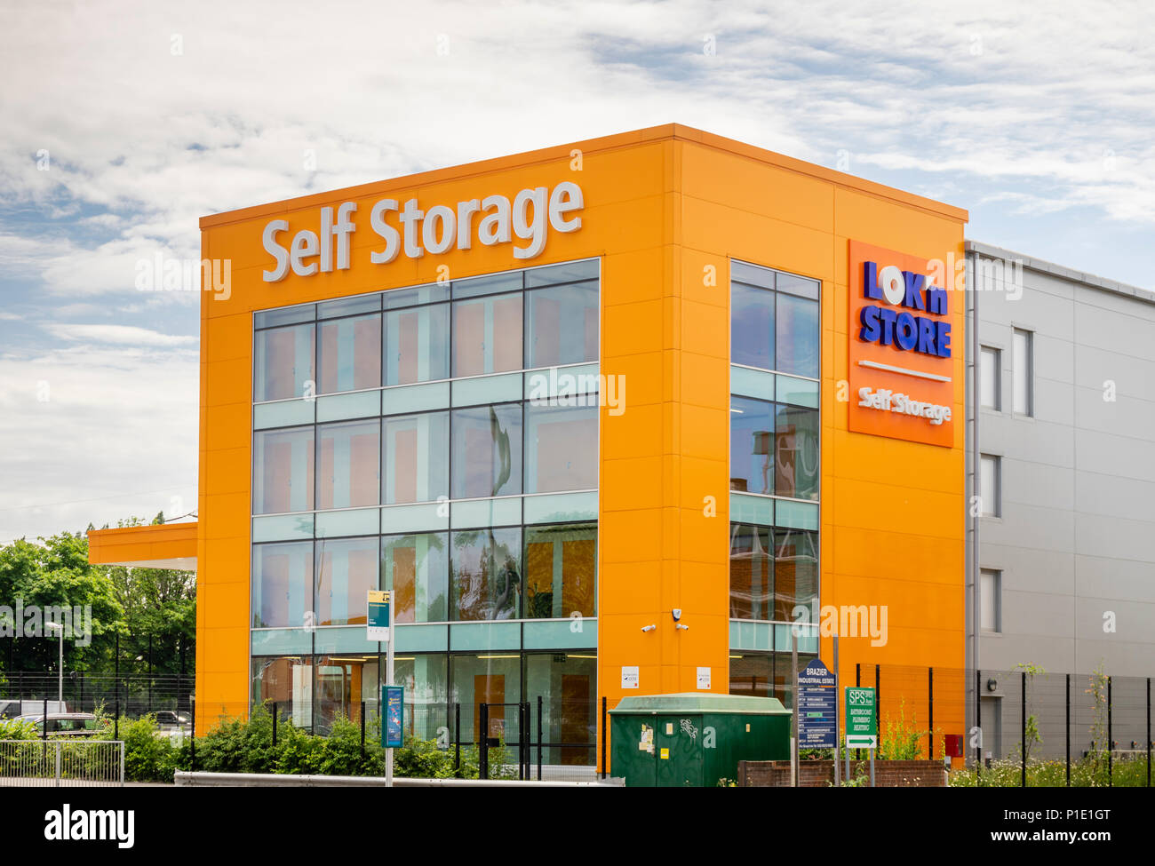 Orange coloured building facade of a Loknstore self age unit in Southampton, England, UK Stock Photo