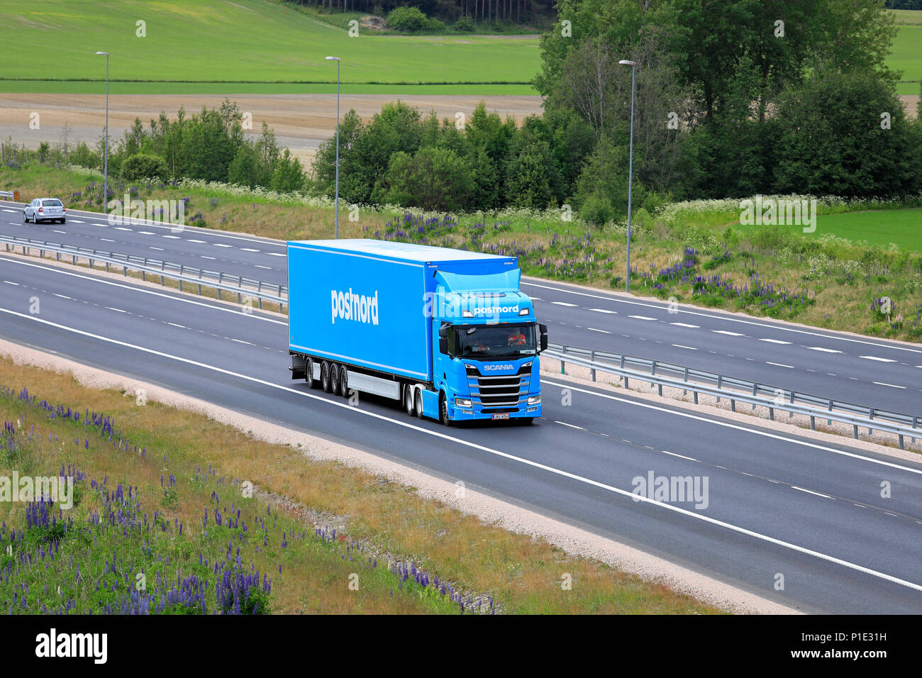 Scania semi trailer of FE-Trans for PostNord Logistics hauls load on  motorway through Finnish country landscape in summer. Salo, Finland - June  9, 18 Stock Photo - Alamy