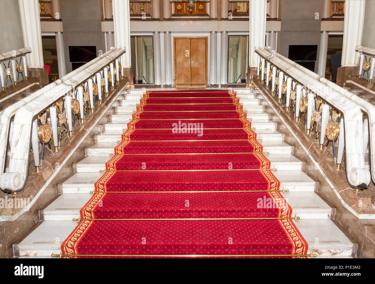 Stairwell in the Polish palace. Royal castle in Warsaw.Red carpet. Stock Photo
