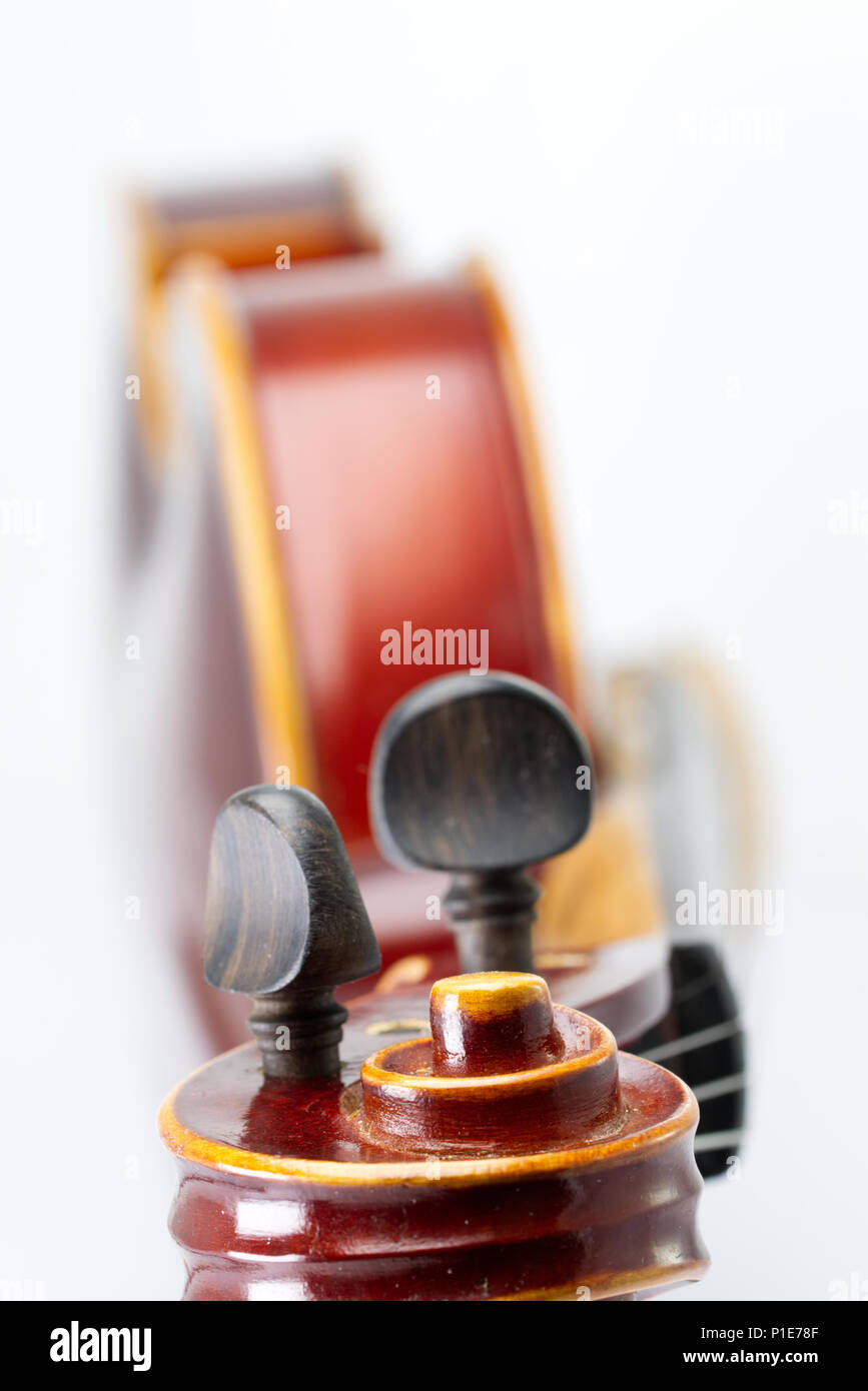 Violin isolated on a white background with shallow depth of field ...