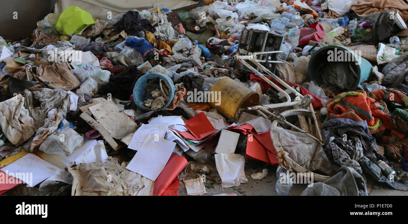 homeless shelter with rags and broken items without people Stock Photo ...