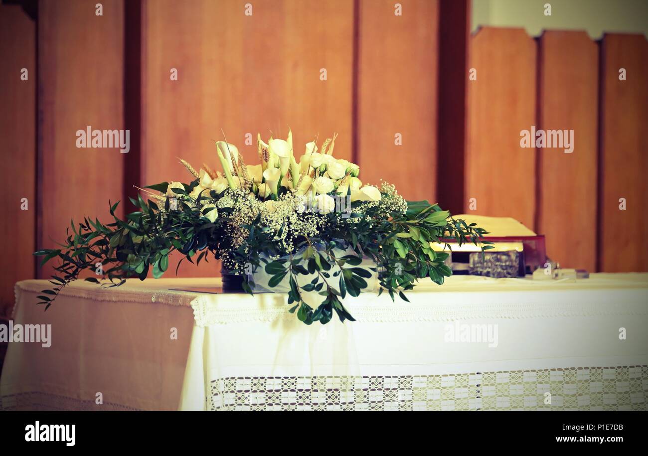 potted flowers on the altar in the church with vintage effect Stock