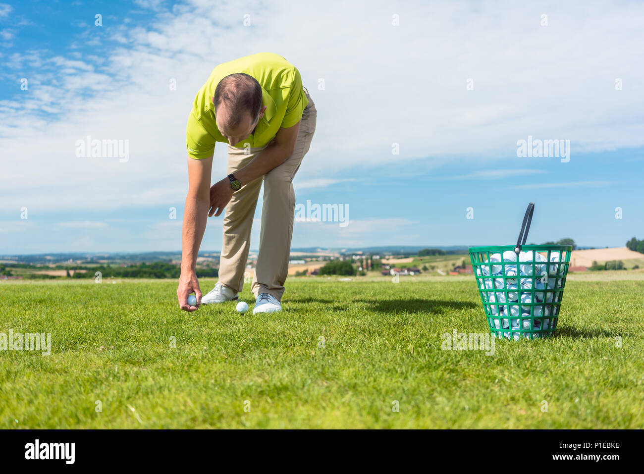 Close-up of the hand of a professional male golf player taking a ball Stock Photo