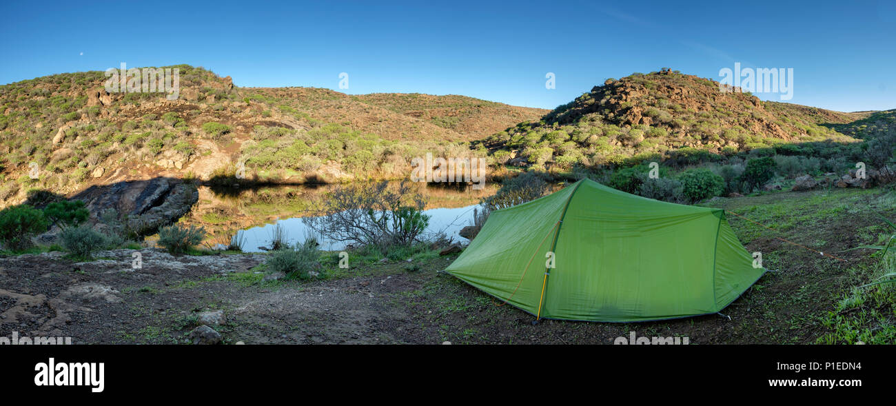 Tent at a pond near the reservoir Presa de Chira, Gran Canaria, Canary Islands, Spain Stock Photo