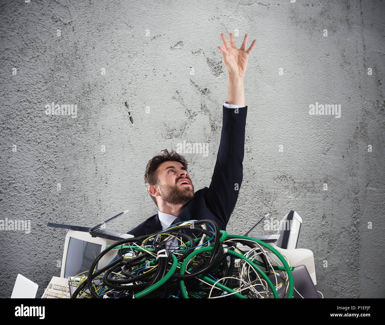Businessman trapped by cables. concept of stress and overwork Stock Photo