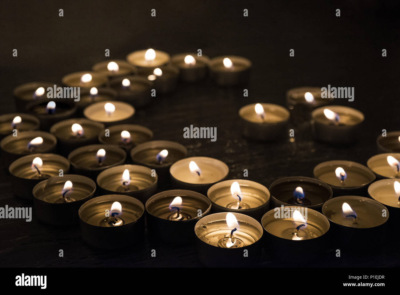 Symbols of Islam. Candle lights on black background. Abstract isolated