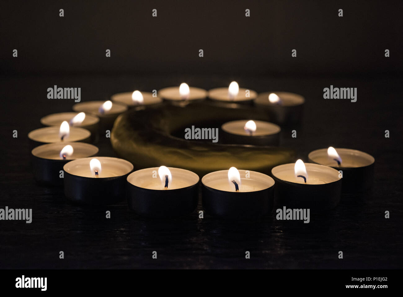 Symbols of Islam. Candle lights on black background. Abstract isolated