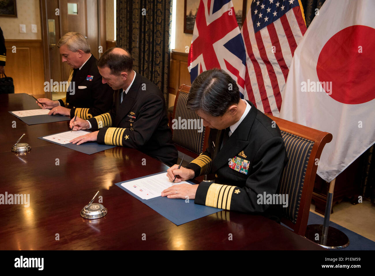 161020-N-ES994-051  WASHINGTON (Oct. 20, 2016) Chief of Naval Operations (CNO) Adm. John Richardson; First Sea Lord, United Kingdom Royal Navy, Adm. Sir Phillip Jones; and Chief of Staff of the Japan Maritime Self-Defence Force, Adm. Tomohisa Takei, signed an agreement affirming their commitment to increased collaboration and cooperation, following a trilateral maritime discussion, Oct. 20, in the Pentagon. This is the first time the three chiefs have held such an event. Given the increase in maritime traffic worldwide and current events, the symbolism of this engagement can’t be overstated. ( Stock Photo